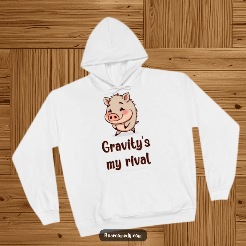 Funny cozy hoodie with a small round boar character tripping with a funny, wide-eyed expression.