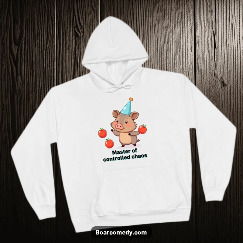Funny Hoodie: Cute boar in a party hat, skillfully juggling three apples, offering warmth and comedic joy.