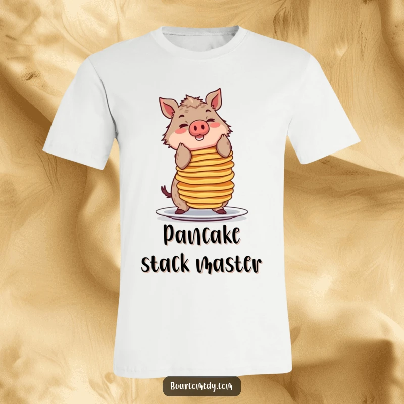 Funny t-shirt depicting a smiling boar character precariously balancing a huge stack of pancakes, a breakfast comedy scene.
